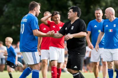 epa06073934 Italian former soccer player Alessandro Del Piero (L) greets Argentinian former soccer star Diego Maradona during the Gianni's game, a soccer match with many football legends, at the stadium Sportplatz Geschina, in Brig, Switzerland, 07 July 2017. EPA/JEAN-CHRISTOPHE BOTT
