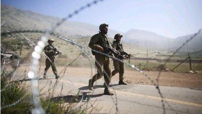 Israeli soldiers operate along Israel's border with Syria a day after pro-Palestinian demonstrators stormed a ceasefire line.