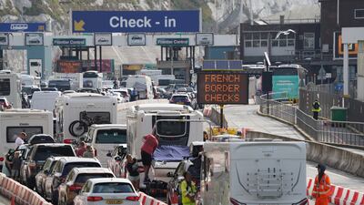 Cars queue to enter the Port of Dover in Kent as families embark on summer getaways following the start of holidays for many schools in England and Wales. PA