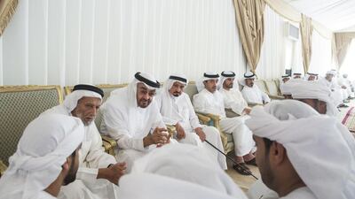 Sheikh Mohammed bin Zayed, Crown Prince of Abu Dhabi and Deputy Supreme Commander of the Armed Forces, offers condolences to the family and friends of Ali Mohammed Al Kaabi, who passed away while serving the UAE Armed Forces in Operation Restoring Hope in Yemen. Seen with Al Kaabi’s father Mohamed Al Kaabi (2nd L), Sheikh Humaid bin Rashid, Ruler of Ajman, Sheikh Abdullah bin Zayed, Minister of Foreign Affairs and International Cooperation, Sheikh Rashid bin Humaid, and Sheikh Khalifa bin Tahnoon (7th L). Ryan Carter / Crown Prince Court — Abu Dhabi