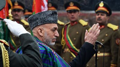 Afghan president Hamid Karzai inspects a honor guard before delivering his final address in parliament in Kabul on March 15. Wakil Kohsar / AFP PHOTO