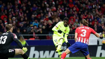 Ousmane Dembele scores Barcelona's equaliser against Atletico Madrid on Saturday. AP Photo