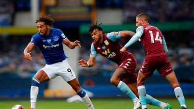 Everton striker Dominic Calvert-Lewin vies with Aston Villa defender Tyrone Mings and midfielder Conor Hourihane. AFP