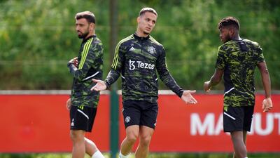 Manchester United's Antony, centre, during training. PA