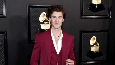 Shawn Mendes wears a maroon suit by Louis Vuitton for the 62nd Annual Grammy Awards. EPA