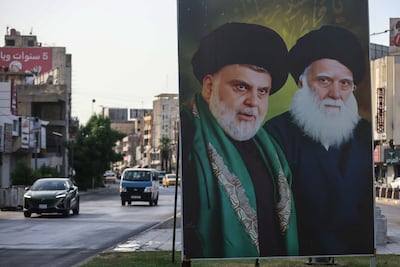 A banner showing Iraqi cleric Moqtada Al Sadr and his grandfather in Baghdad. AFP