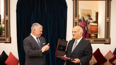 King Abdullah II bestows the Order of the State Centennial on Prince El Hassan bin Talal. Photo: @RHCJO via Twitter