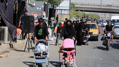 Iraqi Shiite pilgrims make their way to the tomb of Imam Hussain in Baghdad. EPA