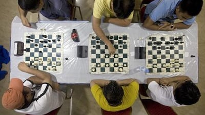 Players study their next move during the Filipino Chess Players League tournament in Reef Mall in Deira.