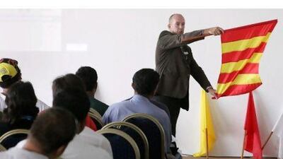 Volunteers receive indepth training from the Automobile & Touring Club of the UAE before they can work by the track.