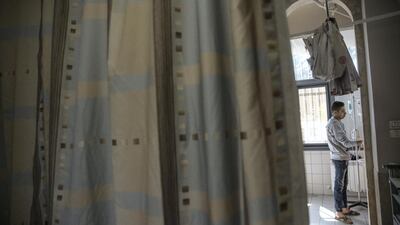 Sixteen-year-old Loay Hani Abu Haniya, who has colon cancer, during his chemotherapy treatment at the oncology department.