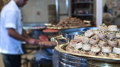 A chef's assistant prepares the food display. Victor Besa / The National