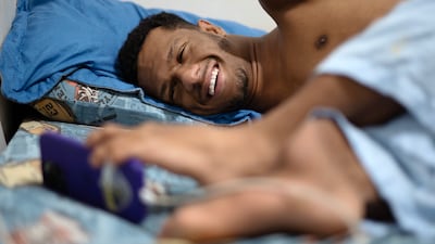 Gabriel uses his phone to keep his friends and family updated with his diving