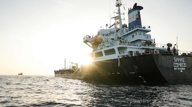 A commercial vessel is anchored off Yemen's coast at Bab al-Mandeb, in the straits connecting the Red Sea with the Gulf of Aden and the Indian Ocean on September 12, 2026. Yemen's Houthis took over on September 11, 2026, a Red Sea island of Mayyun that is located in the middle of the Bab al-Mandeb shipping lane, completing their push to control the area, a local government official and eyewitnesses told AFP. Hundreds of people have died since the Iran-backed Houthis launched an offensive around Bab al-Mandab, a vital artery for Saudi oil exports. (Photo by AFP) /