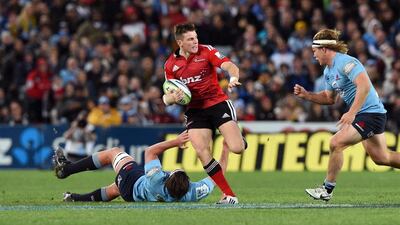 Canterbury Crusaders flyhalf Colin Slade, centre, also stars for the New Zealand rugby national team. AFP PHOTO/William WEST