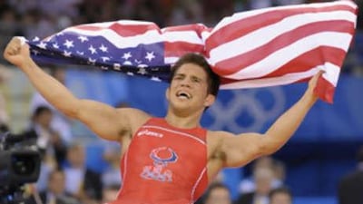 Henry Cejudo of the US celebrates his victory over Japan's Tomohiro Matsunaga in the men's 55kg freestyle gold medal match.