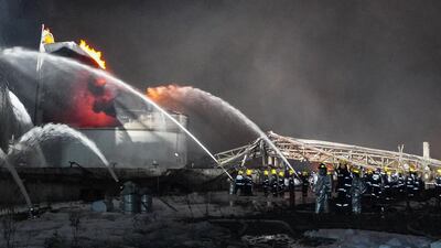 Firemen work following an explosion at a chemical plant. AFP