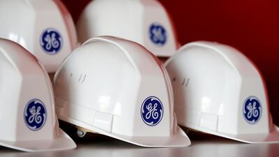 The General Electric logo is pictured on workers' helmets at the GE offshore wind turbine plant in Montoir-de-Bretagne, western France. Stephane Mahe/Reuters