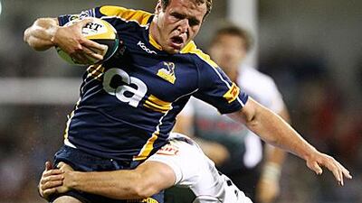 Ben Alexander, of the CA Brumbies, runs with the ball during their Super 14 game against the Natal Sharks yesterday.