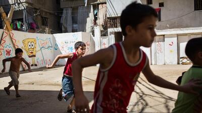 Palestinian refugees from Syria play in the streets of Shatila refugee camp, in Beirut, Lebanon. Andrew McConnell for The National