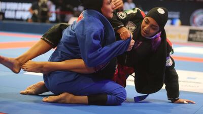 Alyazyah Al Shehyari (in black) of the UAE shown in her match with May Sherif Mahmoud of the UAE in the Abu Dhabi World Youth Jiu-Jitsu Championship 2016. Ravindranath / The National