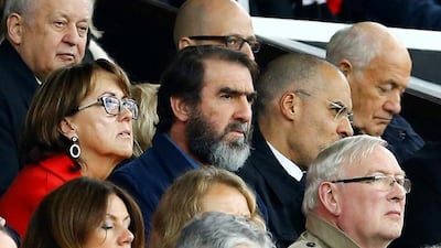 Former Manchester United great Eric Cantona, centre, in the stands for the Manchester United v Leicester City match at Old Trafford on Sunday. Reuters / Darren Staples