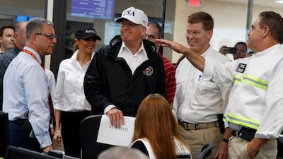 President Donald Trump and first lady Melania Trump participate in a tour of the Texas Department of Public Safety Emergency Operations Center in Austin, Texas. Evan Vucci / AP Photo