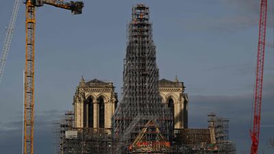 Scaffolding surrounds a wooden spire being rebuilt at Notre-Dame cathedral in Paris, following the fire in April 2019. The cathedral is scheduled to reopened at the end of 2024. AFP