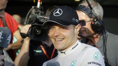 Mercedes driver Valtteri Bottas otalks to reporters after winning the Formula One Russian Grand Prix on April. 30, 2017. Sergei Grits / AP Photo