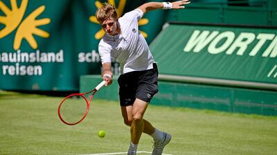 Ilya Ivashka lays a forehand to Roger Federer during their Halle Open first round match. Getty Images