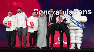 Saleh Mohamed Al Geziry, Director General Tourism Sector at the Department of Culture and Tourism – Abu Dhabi, with chefs from restaurants awarded one Michelin star.