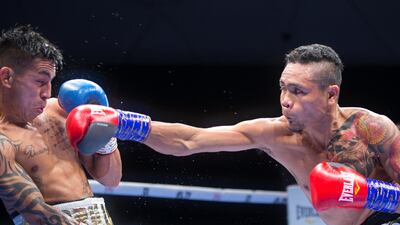 Donnie Nietes of the Philippines hitting Pablo Carillo of Colombia at the Rotunda, Ceasar's Palace, Bluewaters Island, Dubai. Leslie Pableo for The National