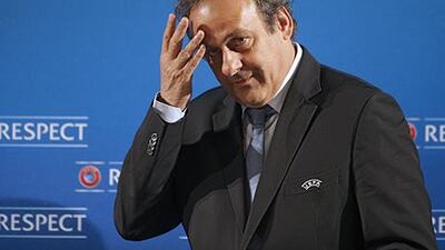 Michel Platini is considered a protege to Sepp Blatter when it comes to football politics. Lionel Cironneau / AP Photo