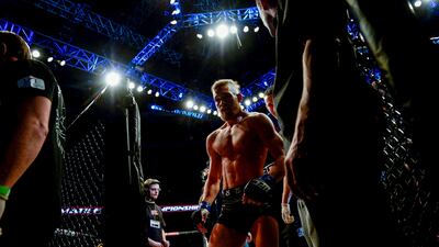 Ireland's Conor McGregor leaves the cage after defeating USA's Marcus Brimage in their UFC fight at the Globe Arena in Stockholm, Sweden, on April 6, 2013.