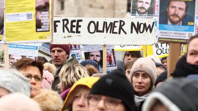 People gather in Brussels on Sunday to protest against the detention of Belgian aid worker Olivier Vandecasteele in Iran. EPA