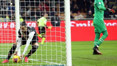 Cristiano Ronaldo picks the ball out of the net after scoring. EPA