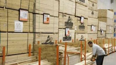 Customers make purchases at a Home Depot in Chicago. Home Depot is the nation's largest home improvement retailer.