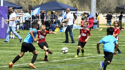 Techers Bahrain (blue) vs. Go Sports (red) under 8 age group.