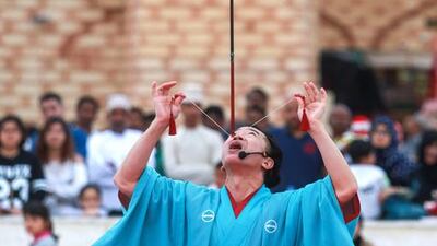 Senmaru of Japan does his balancing act trick. Victor Besa for The National