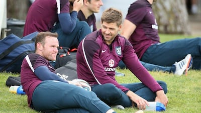 Wayne Rooney and Steven Gerrard look on during an England training session on Wednesday in Portugal. Richard Heathcote / Getty Images / May 21, 2014