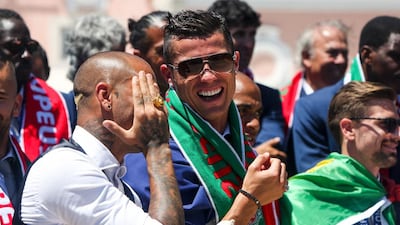 Portugal’s forward Cristiano Ronaldo (R) and Portugal’s forward Ricardo Quaresma laugh as they celebrate their victory at Belem Palace on July 11, 2016 after their Euro 2016 final football win over France yesterday. The Portuguese football team led by Cristiano Ronaldo returned home to a heroes’ welcome today after their upset 1-0 win triumph over France in the Euro 2016 final. AFP / NUNO FOX