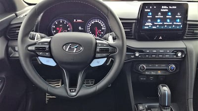 Inside, you get lightweight sports seats and a grippy three-spoke steering wheel with flappy paddles to manually shift the eight-speed auto.