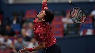 Novak Djokovic of Serbia serves during his men's singles third round match against John Isner of the US in Shanghai. AFP