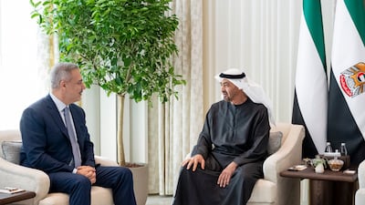 President Sheikh Mohamed, right, with Turkish Foreign Minister Hakan Fidan. Mohamed Al Hammadi / UAE Presidential Court