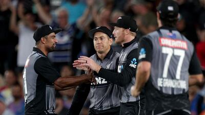 New Zealand players celebrate the wicket of India captain Virat Kohli during the first T20 in Auckland. AFP