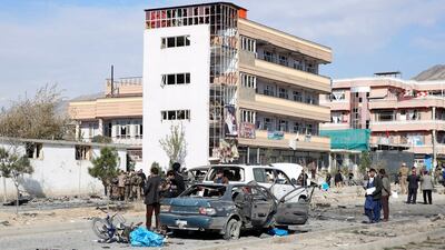 Afghan security forces inspect the site of a car bomb attack, which targeted a convoy of Ministry of Interior Affairs advisors. EPA