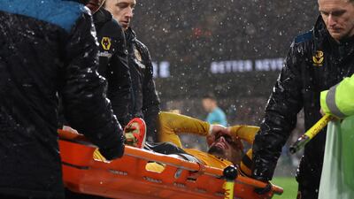 Wolverhampton Wanderers' Pedro Neto leaves the game on a stretcher after picking up a hamstring injury. AFP