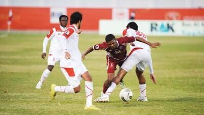 In a Group A match in Ras Al Khaimah, Al Wahda, in red, kept alive their flickering hopes of advancing to the Etisalat Cup semi-finals by defeating Emirates 2-0.