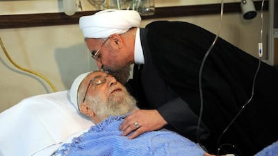 A handout picture made available by the Iranian supreme leader official website shows Iranian president Hassan Rouhani, right, kissing Iranian supreme leader Ayatollah Ali Khamenei after his prostate surgery in Tehran, Iran on September 8, 2014. Iran Supreme leader website/EPA