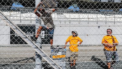Abu Dhabi Grand Prix preparations 2019. Pyrotechnic engineers attach fireworks on track for the awards ceremony celebrations. Victor Besa / The National